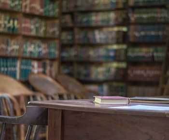 Empty chairs and table in shelf