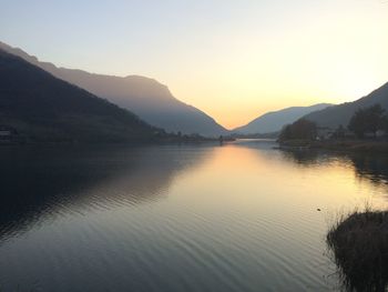 Scenic view of lake at sunset