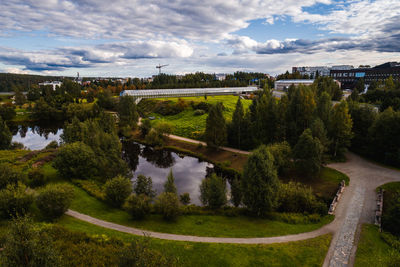 Scenic view of lake by trees against sky