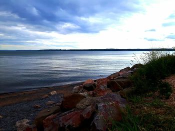 Scenic view of sea against cloudy sky