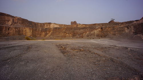 Scenic view of arid landscape against clear sky