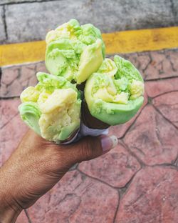 High angle view of person holding ice cream