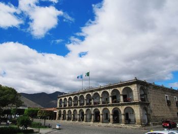 Low angle view of historical building against cloudy sky