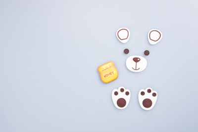 Directly above shot of bear shape food over white background