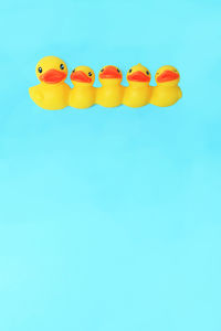 Close-up of toys against blue background