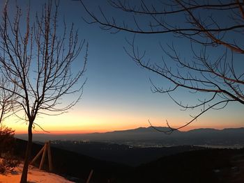 Scenic view of mountains against sky during sunset