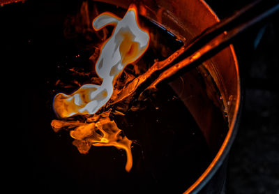 Close-up of bonfire against black background