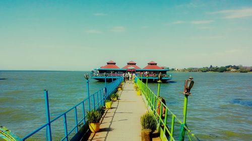 View of jetty leading to sea