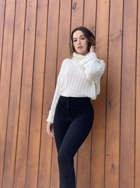 High angle view of young woman on hardwood 