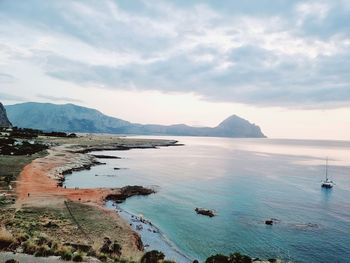 Scenic view of bay against sky