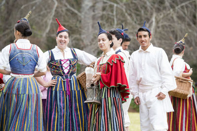 Portrait of people standing outdoors