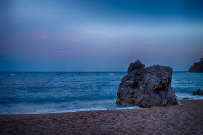 Scenic view of sea against blue sky