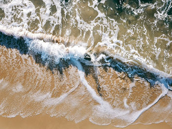 Close-up of wave on beach