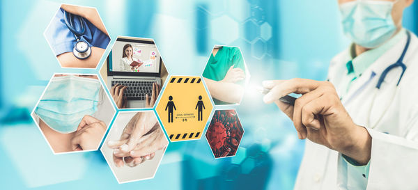 Midsection of man using mobile phone