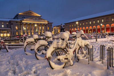 Graffiti on snow covered city at night