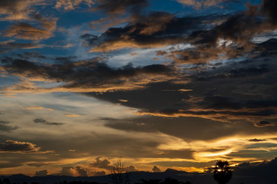 Low angle view of dramatic sky during sunset