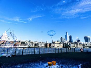 Bridge over river with buildings in background