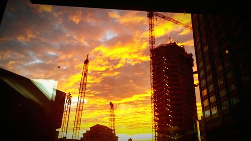 Low angle view of building against cloudy sky