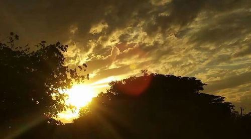 Scenic view of landscape against sky at sunset