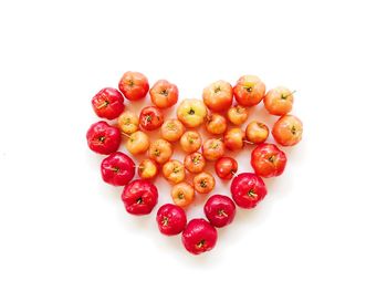 High angle view of heart shape over white background