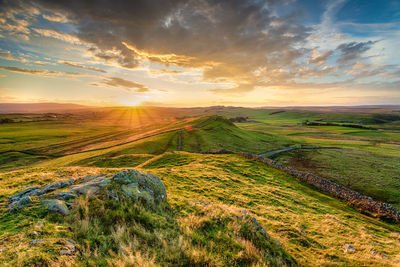 Scenic view of landscape against sky during sunset