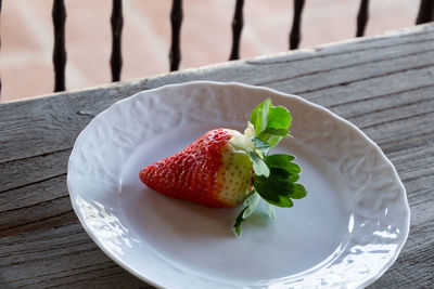 Close-up of strawberry in plate on table
