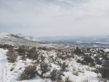 Scenic view of snowcapped mountains against sky