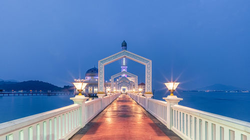 Illuminated bridge over sea