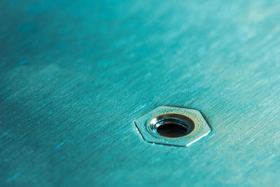 Single nut in metal surface texture