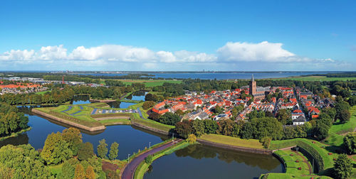 High angle view of trees and buildings against sky