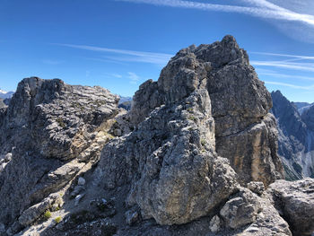 Low angle view of rock formation against sky