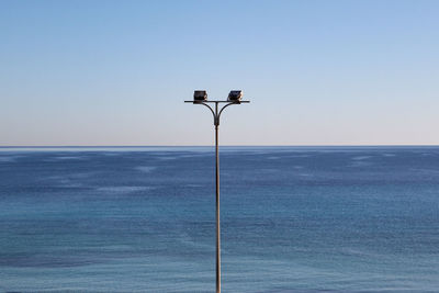 Low angle view of street light against sky