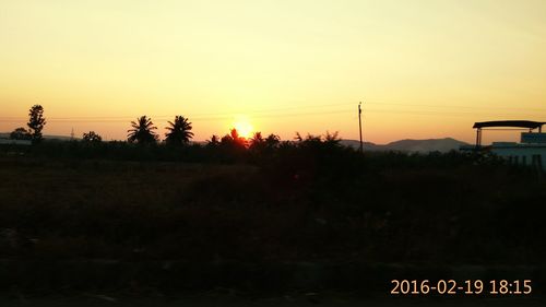 Scenic view of landscape at sunset