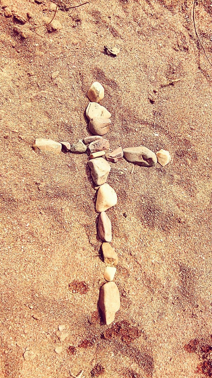 sand, high angle view, textured, beach, close-up, still life, full frame, backgrounds, no people, ground, day, outdoors, directly above, nature, pattern, sunlight, footprint, brown, pebble, rough