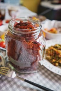 High angle view of fruits in jar on table