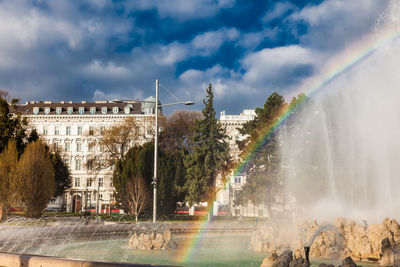 View of the beautiful buildings at vienna city center and the fountain at schwarzenbergplatz