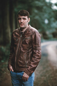 Portrait of young man standing outdoors