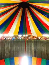 Low angle view of colorful umbrellas hanging on ceiling