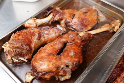 High angle view of meat on barbecue grill