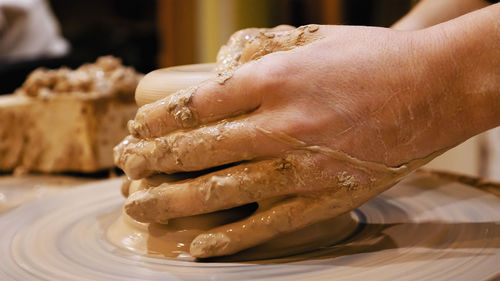 Close-up of hand holding ice cream