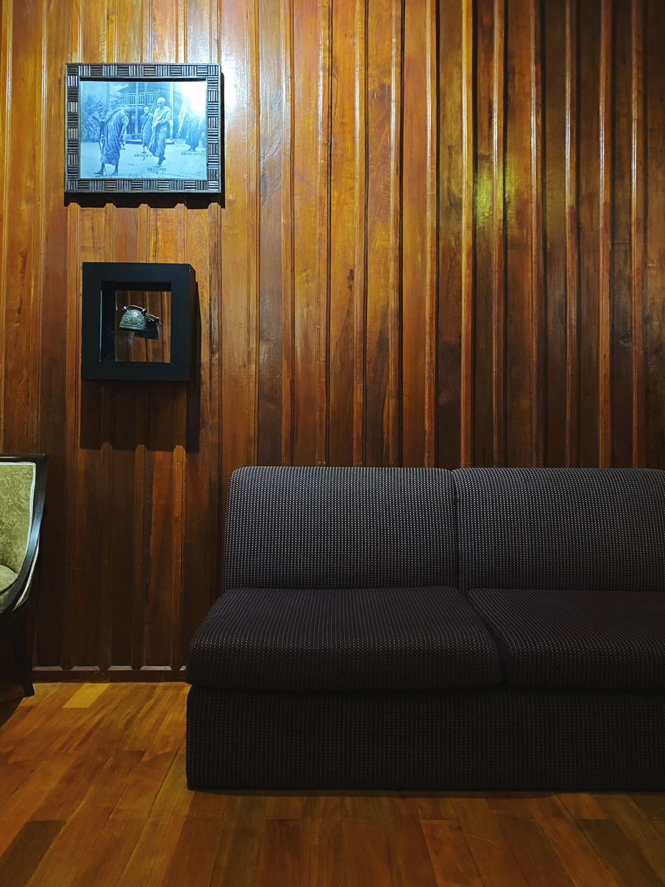 EMPTY CHAIR ON TABLE AGAINST WALL AT HOME