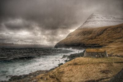 Scenic view of sea against cloudy sky