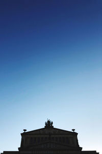 Low angle view of building against blue sky