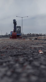 Surface level of road against sky in city