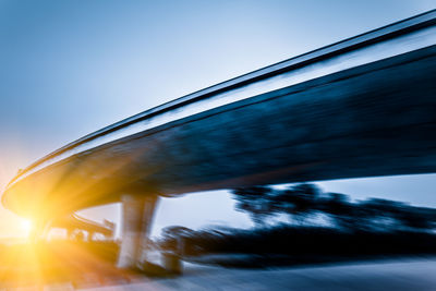 Low angle view of bridge against clear blue sky