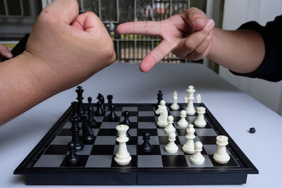 People playing on chess board