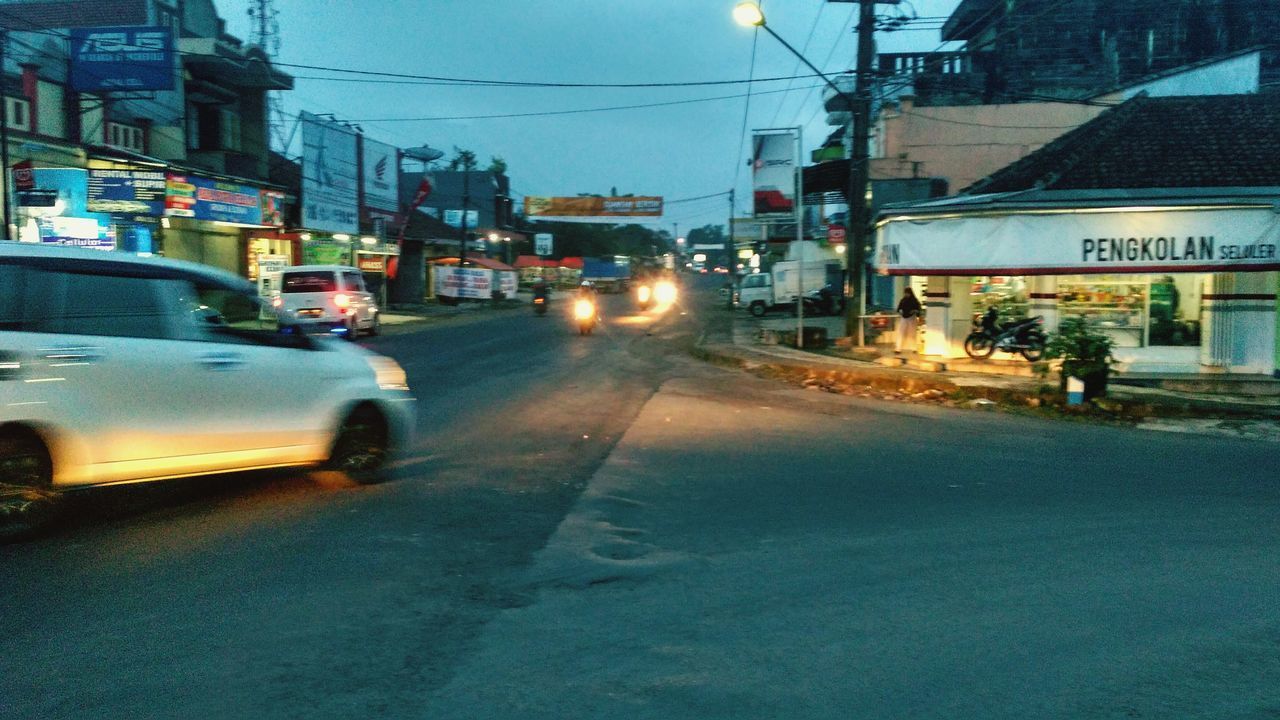 CARS ON STREET AT NIGHT