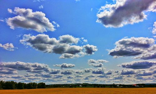 Scenic view of landscape against cloudy sky