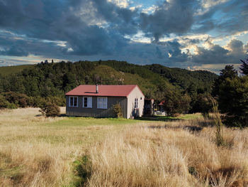 House on field against sky