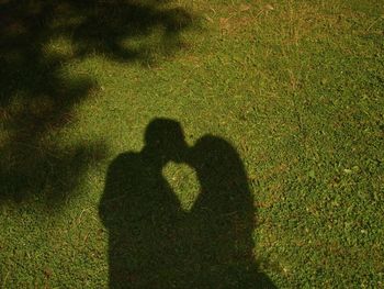 Shadow of person on grass